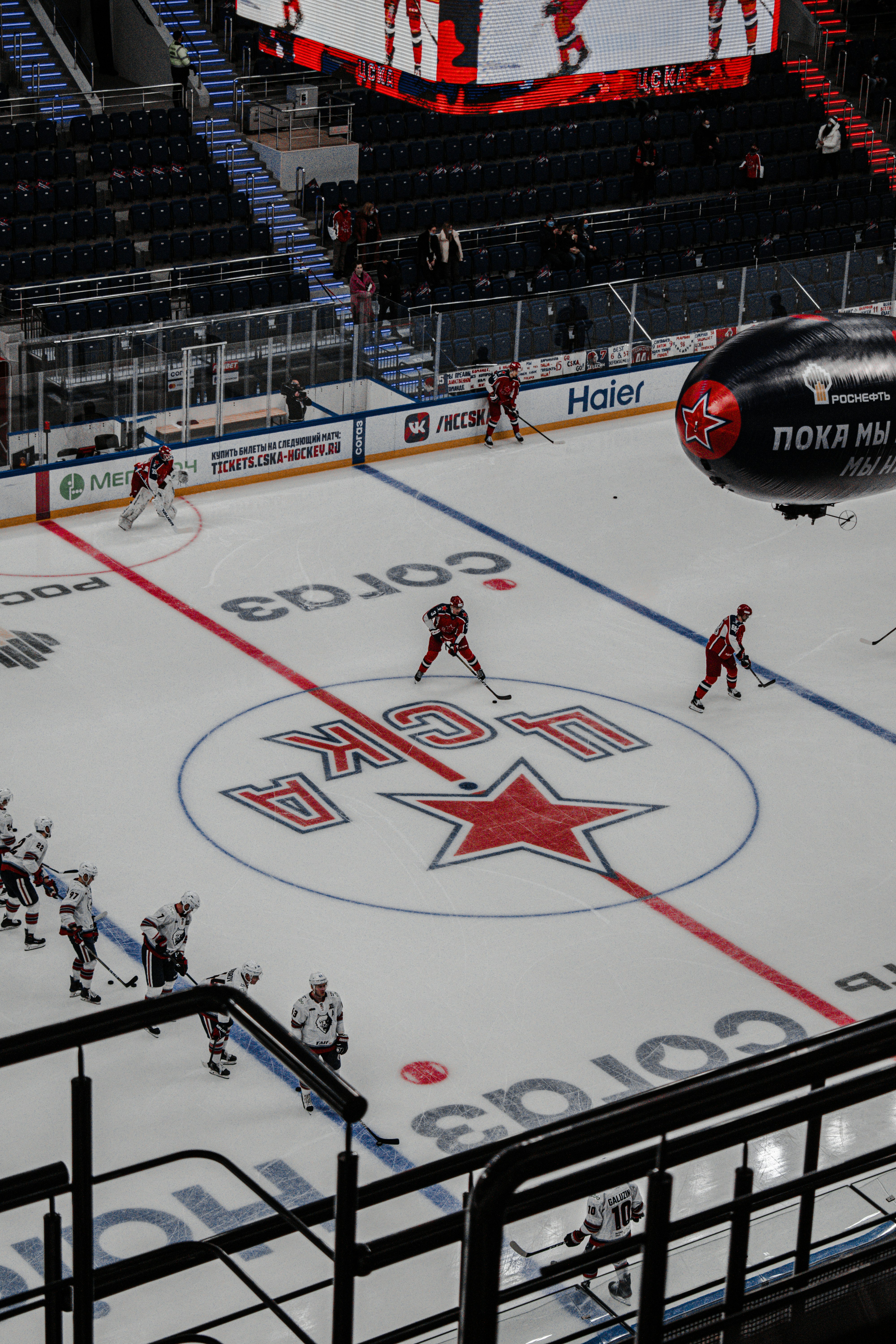 people playing ice hockey on stadium